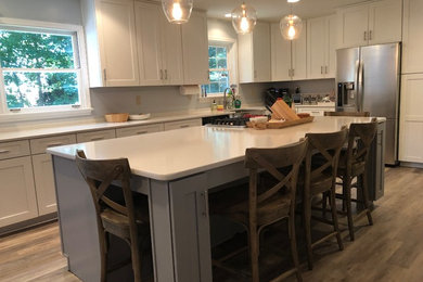 Inspiration for a mid-sized modern galley eat-in kitchen remodel in Richmond with shaker cabinets, white cabinets and an island