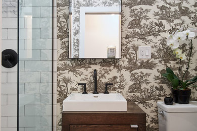 Design ideas for a contemporary bathroom in Chicago with dark wood cabinets, multi-coloured walls, slate floors, wood benchtops, flat-panel cabinets, a two-piece toilet, white tile, subway tile and a vessel sink.