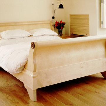 Ripple, figured sycamore veneered and solid sycamore lit bateau bed