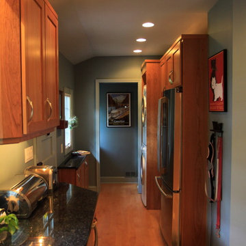 Cohesive Transitional Kitchen | Cherry Cabinets & Black Granite Table