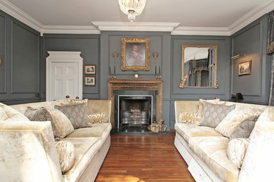 Design ideas for a traditional living room in Other with grey walls.