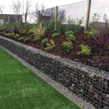 Artificial Grass and Pebble filled Gabion walling