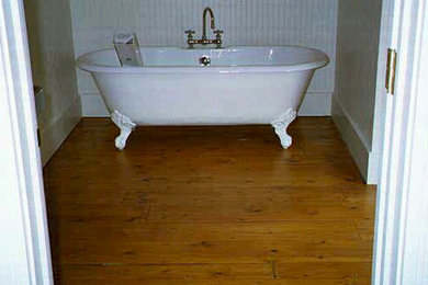 Small elegant master light wood floor bathroom photo in Other with white walls