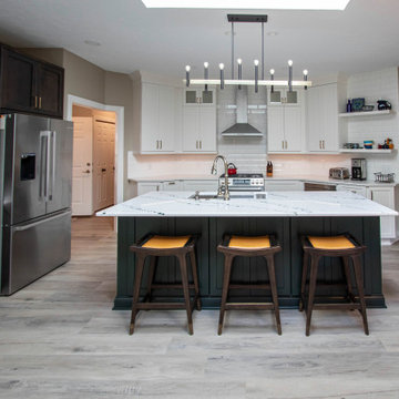 3 Finishes on Kitchen Cabinetry with Galley Workstation in Island and Wine Bar