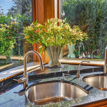 Luxury Mid-Century Kitchen with Custom Wood Cabinetry and Stone Countertops