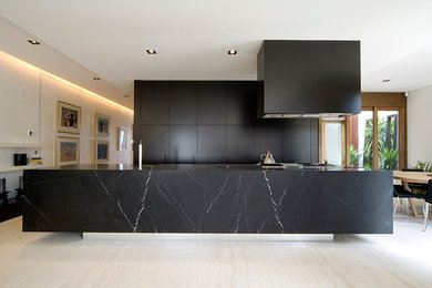 Photo of a contemporary kitchen in Melbourne with with island.