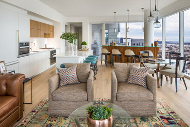 Living room - mid-sized eclectic open concept light wood floor living room idea in Portland with white walls, a standard fireplace and a wall-mounted tv