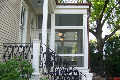 Photo of a traditional house exterior in New Orleans with wood siding.