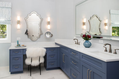 Freestanding bathtub - mid-sized transitional master white tile porcelain tile, white floor, double-sink and wallpaper freestanding bathtub idea in Denver with raised-panel cabinets, blue cabinets, an undermount sink, quartz countertops, white countertops and a built-in vanity