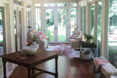 Sunroom - mid-sized transitional dark wood floor and brown floor sunroom idea in Houston with a skylight