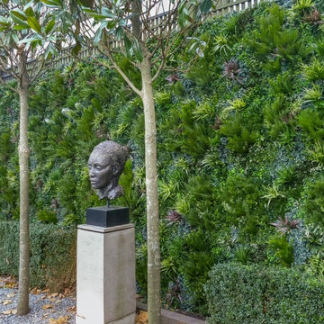 Amazing Sculpture gets Highlighted with Artificial Foliage