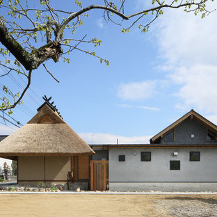 京都のアジアンスタイルのおしゃれな平屋 (マルチカラーの外壁、戸建) の写真