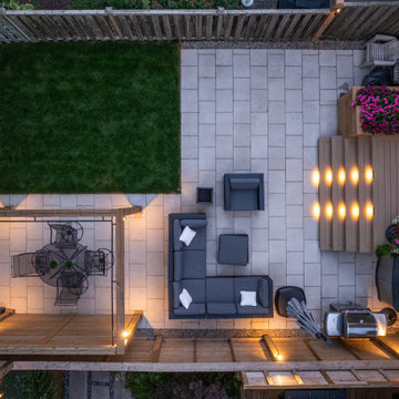 Modern Cedar Pergola, Porcelain Patio & Outdoor Lighting Backyard Renovation