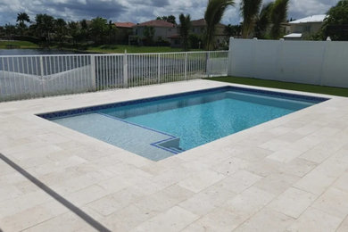 Shell Stone Pool Deck and Turf Installation