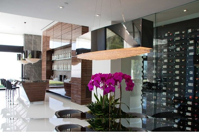 Mid-sized contemporary wine cellar in Vancouver with storage racks.