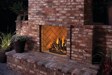 Mid-sized mountain style backyard brick patio photo in Albuquerque with a fire pit and no cover