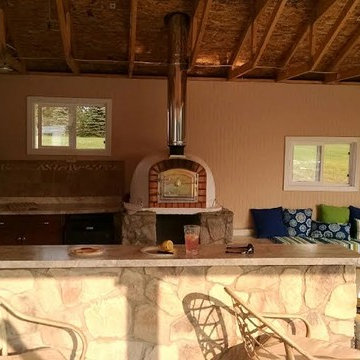 Outdoor kitchen with a brick pizza oven