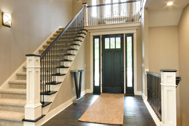 Transitional staircase photo in Grand Rapids