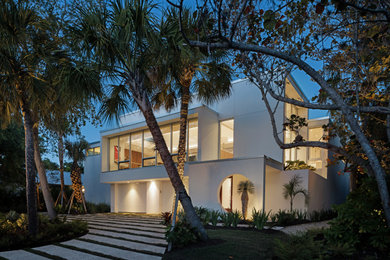Modern white two-story stucco house exterior idea in Tampa