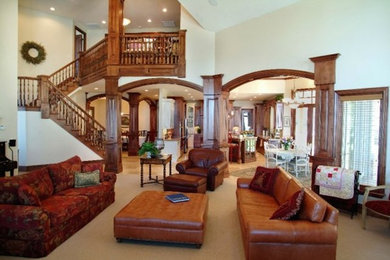 Example of a large open concept carpeted living room design in Salt Lake City with white walls