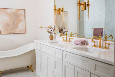 Elegant master bathroom photo with beige cabinets, an undermount sink, marble countertops and a built-in vanity