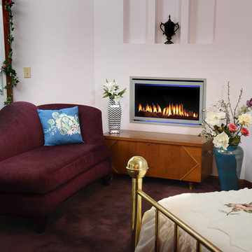 New corner gas fireplace creates a warm reading area in a small bedroom