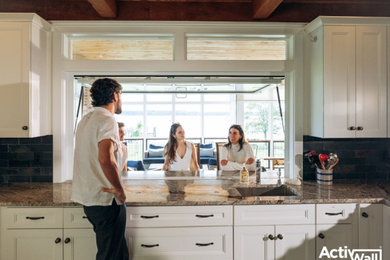 Tuscan exposed beam kitchen photo in DC Metro with an undermount sink, recessed-panel cabinets, white cabinets, ceramic backsplash and brown countertops