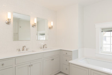 Large traditional master bathroom in Boston with shaker cabinets, grey cabinets, an undermount tub, a corner shower, a one-piece toilet, white tile, mosaic tile, grey walls, marble floors, an undermount sink, engineered quartz benchtops, white floor, an open shower and white benchtops.
