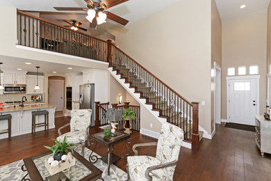 Inspiration for a large transitional entry hall in Salt Lake City with beige walls, medium hardwood floors, a single front door and a white front door.