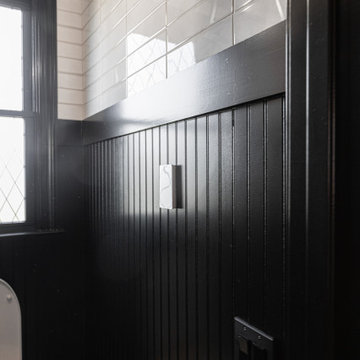 Modern Luxury Master Bathroom with Black Solid Surface Tub