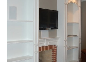 Traditional Custom built-in bookcases and window treatment