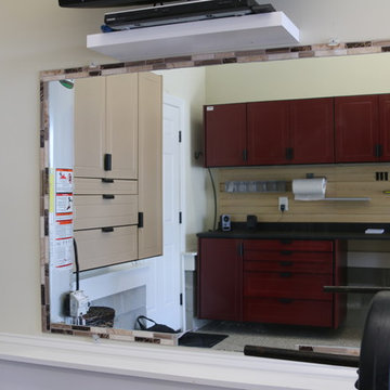 Deep, single wide garage features work bench and exercise area