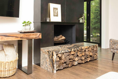Inspiration for a mid-sized modern open concept light wood floor family room remodel in Chicago with white walls, a metal fireplace and no tv