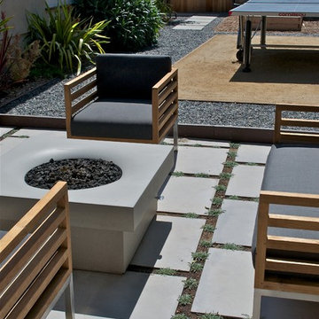 Patio with formed concrete Solus Fire Pit. Outdoor Room play space with DG Custo