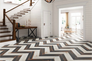 Example of a country medium tone wood floor and multicolored floor entryway design in Other