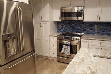 Fantasy Brown Granite with White Shaker Door Cabinets from Forevermark