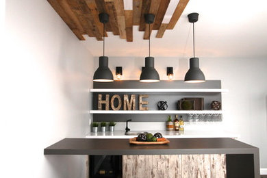 Inspiration for a mid-sized industrial galley dark wood floor home bar remodel in Montreal with gray backsplash