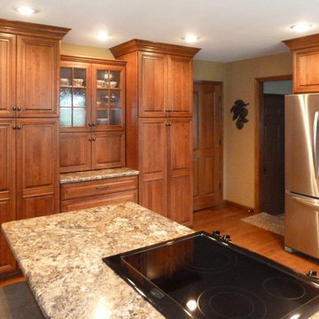 Omega Cabinetry. Destin door, Cherry wood, Nutmeg stain.