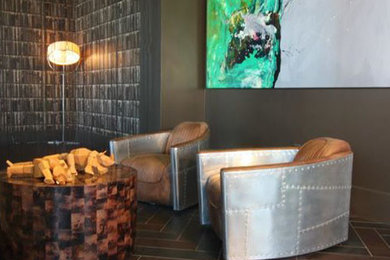 Example of a mid-sized minimalist open concept home theater design in Houston with brown walls and a wall-mounted tv