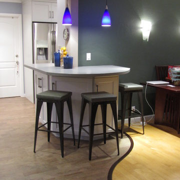 Cork floor with walnut "S" transition to maple hardwood.