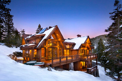 Example of a large mountain style brown two-story wood exterior home design in Sacramento with a shingle roof
