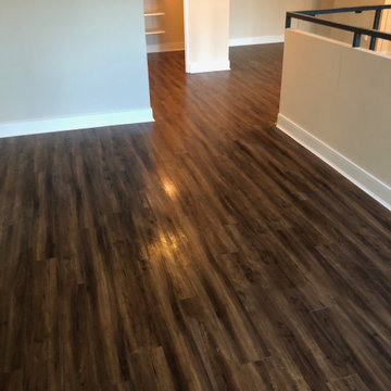 Luxury Vinyl, Baseboard and Custom Oak Staircase