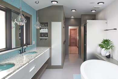 Inspiration for a large modern master white tile and ceramic tile porcelain tile and gray floor bathroom remodel in Other with glass-front cabinets, white cabinets, a bidet, an undermount sink and a hinged shower door