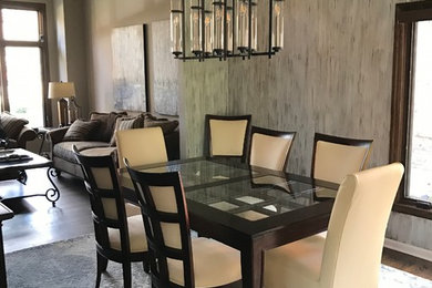 This is an example of a contemporary dining room in Detroit with grey walls.