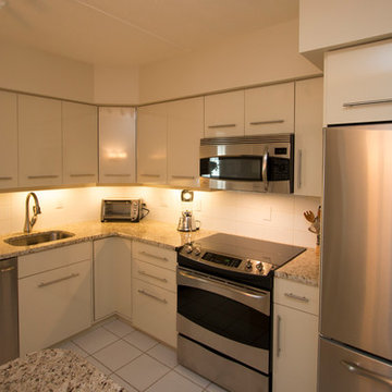 White Contemporary Kitchen with Brushed Nickel Hardware and Granite in Falls Chu