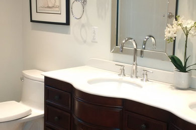Alcove shower - mid-sized transitional master beige tile and mosaic tile porcelain tile alcove shower idea in Toronto with an undermount sink, furniture-like cabinets, dark wood cabinets, quartz countertops, a one-piece toilet and white walls