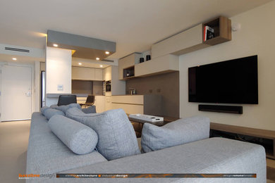 Example of a mid-sized trendy open concept porcelain tile and gray floor living room design in Miami with a wall-mounted tv