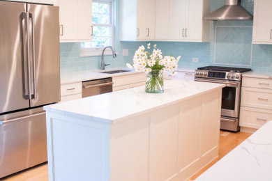 White Kitchen with Aquamarine Tile