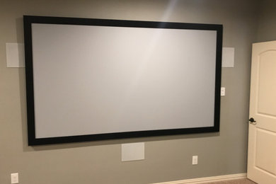Family room photo in Dallas with a wall-mounted tv