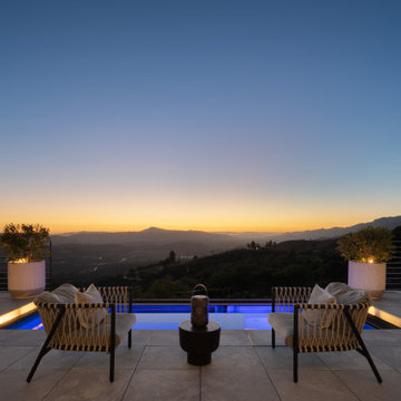 A little farm below a hillside resort-style off-the-grid view home